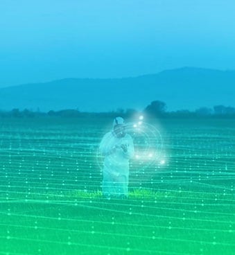 man on farm using a drone to scan a field