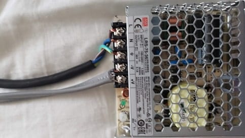 Power supply wired up. NEMA 15-5P on top, 16AWG outdoor lighting on bottom ran to the LED driver board.