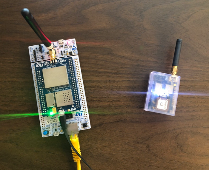 The completed project with the tracker sitting indoors near the gateway board