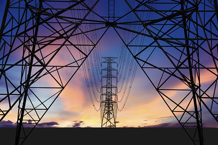 sunset with high voltage towers