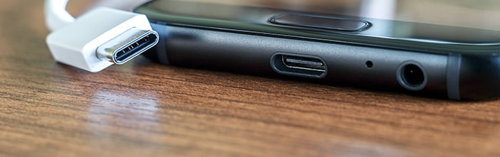 cell phone showing plug and socket of new USB